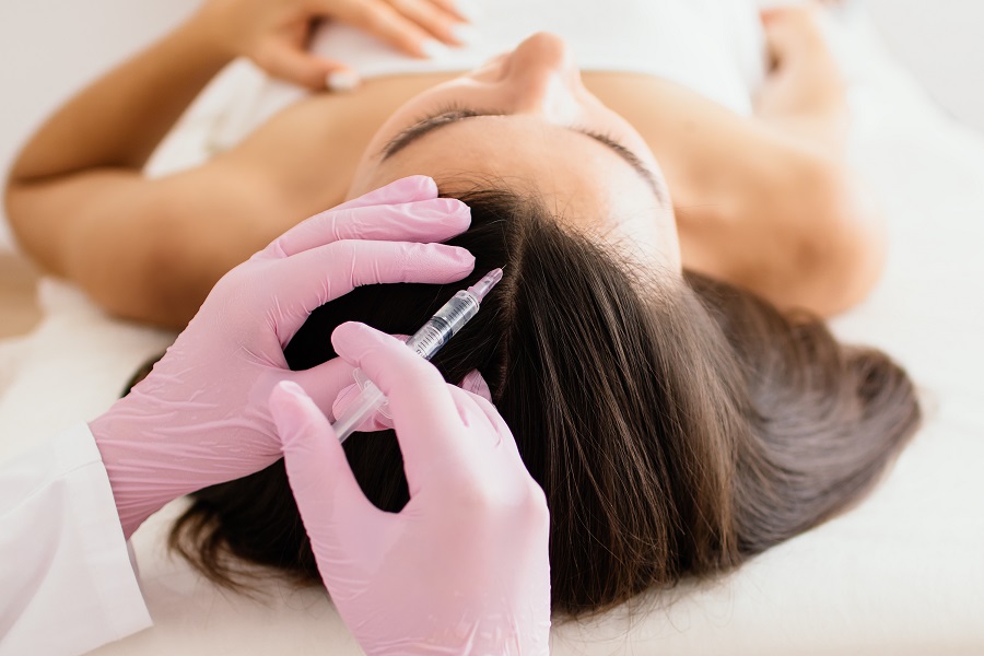 hair treatment in cosmetology using mesotherapy. injection to the head. selective focus